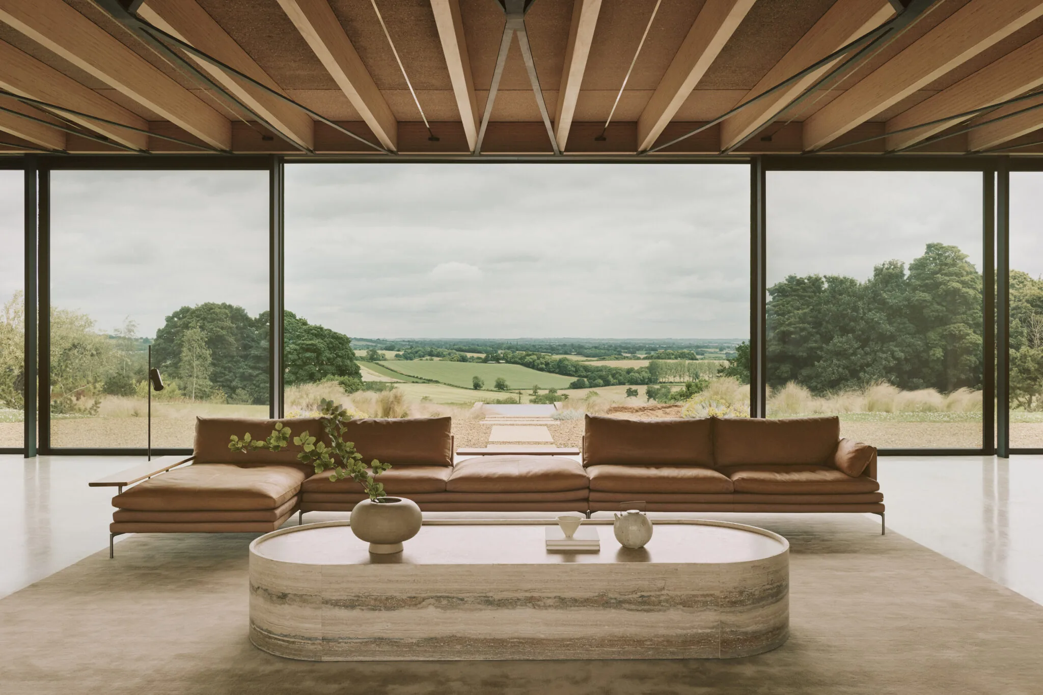 Hollow Water, a living room opening onto the Oxfordshire valley.