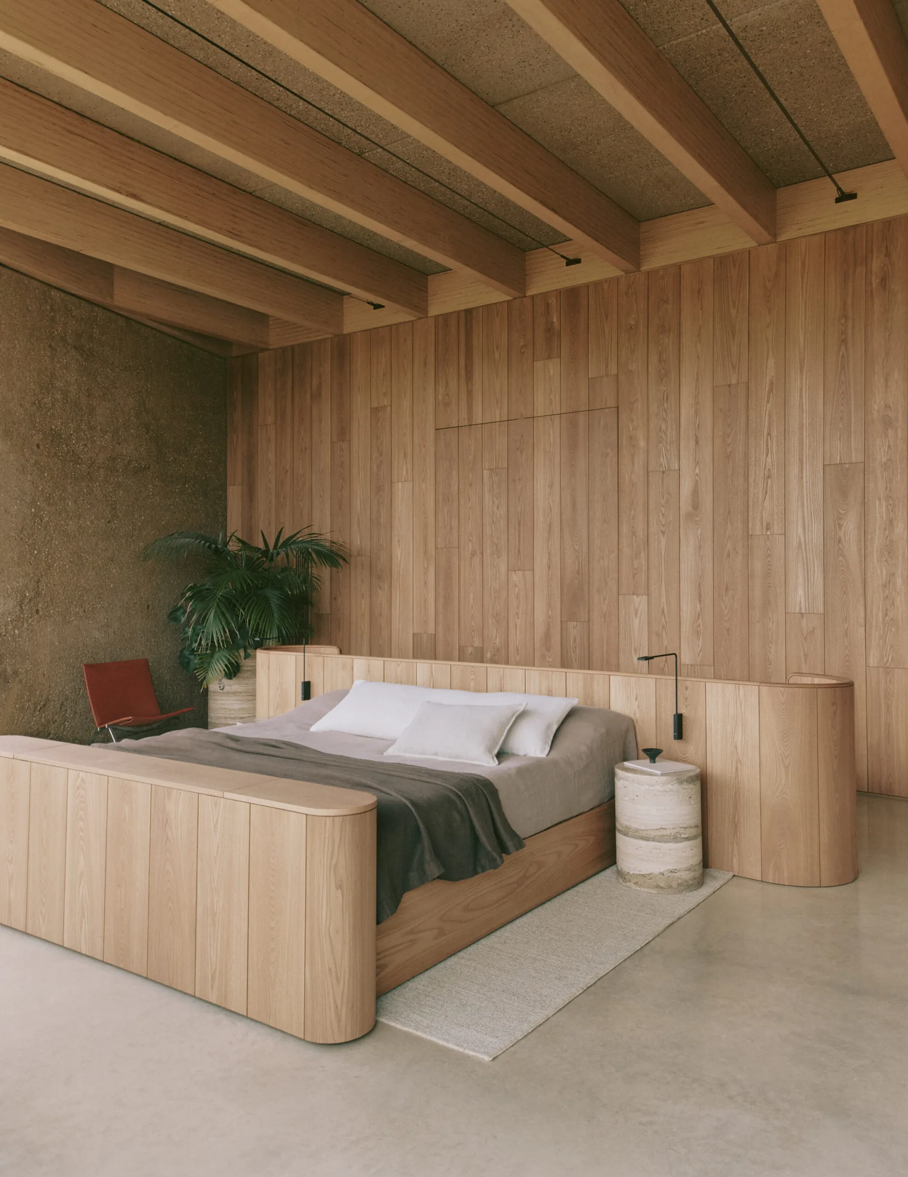 A timber-lined bedroom, calm and close-grained.
